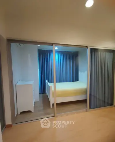 Spacious bedroom with glass sliding doors and modern decor