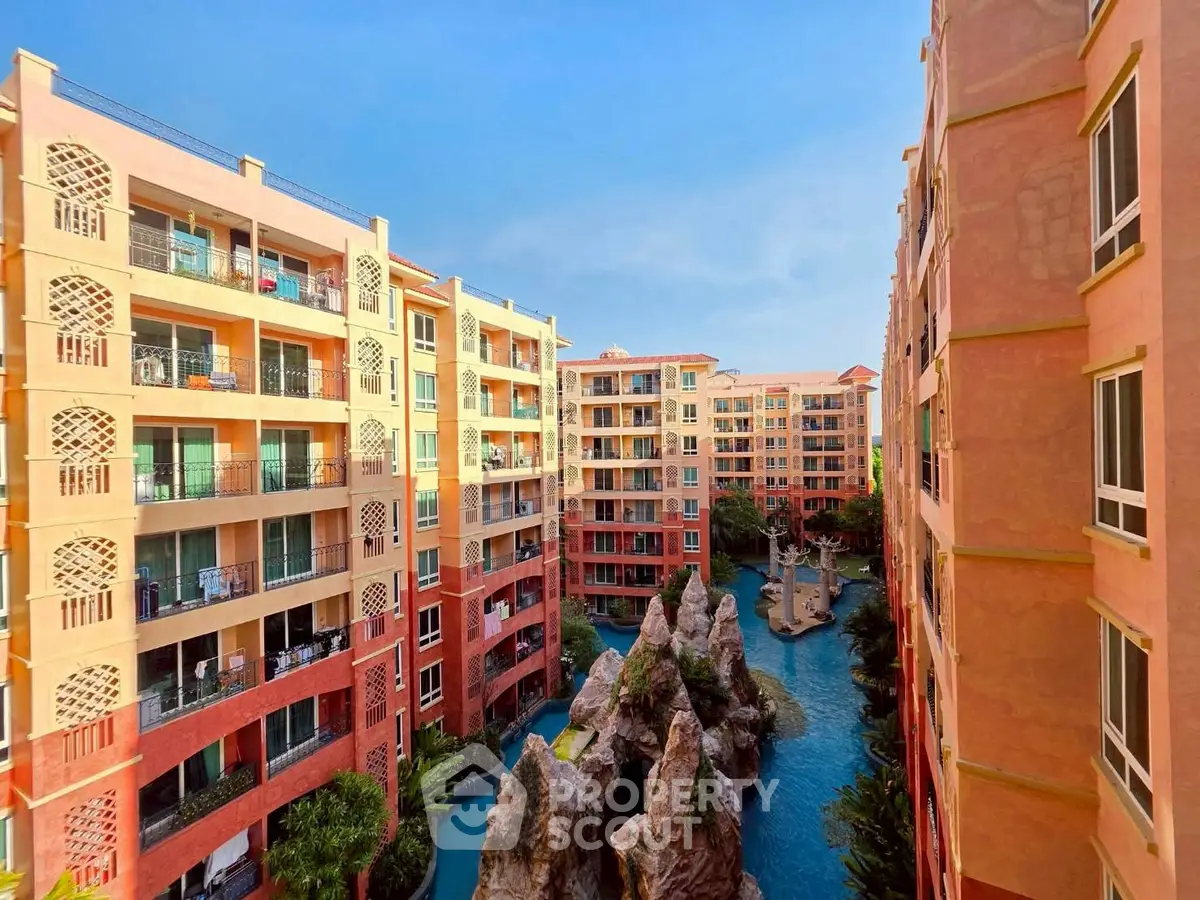 Stunning view of colorful apartment buildings with a unique central water feature.