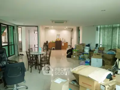 Spacious office space with modern furniture and ample natural light, ideal for business operations.