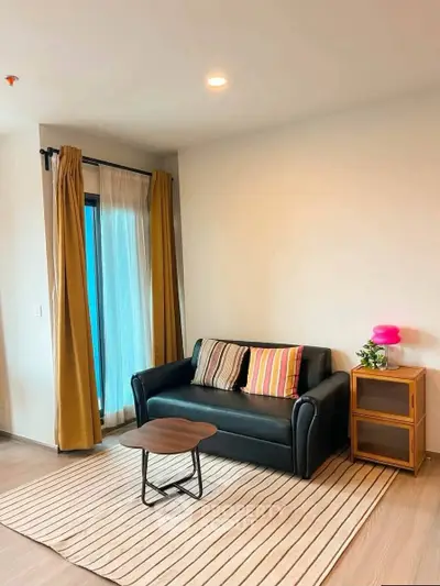 Cozy living room with modern sofa and stylish decor in a bright apartment