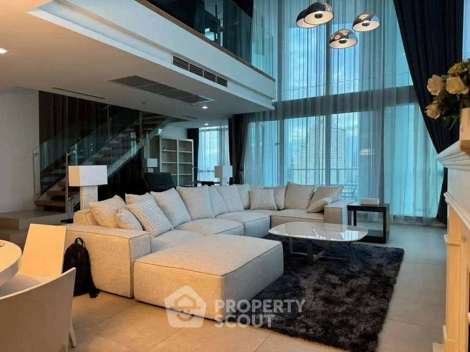 Luxurious modern living room with high ceilings and elegant decor