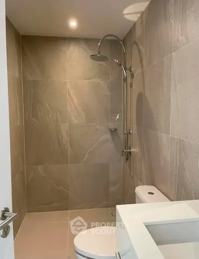 Modern bathroom with sleek shower and elegant tile design