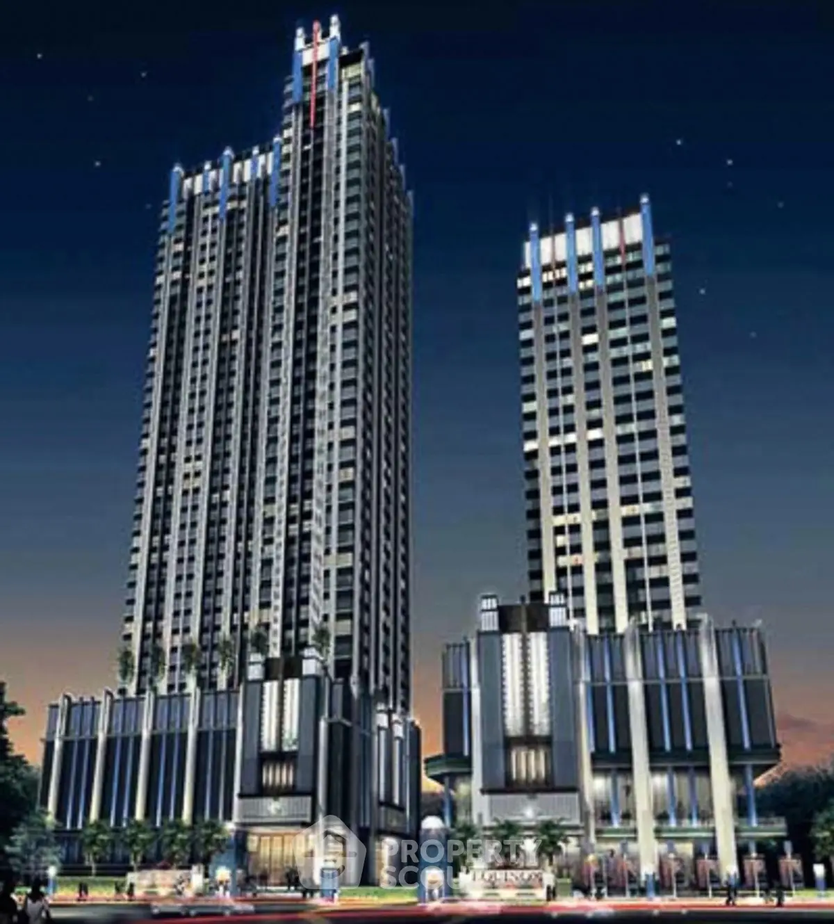 Stunning night view of modern high-rise buildings with illuminated facades and sleek architecture.