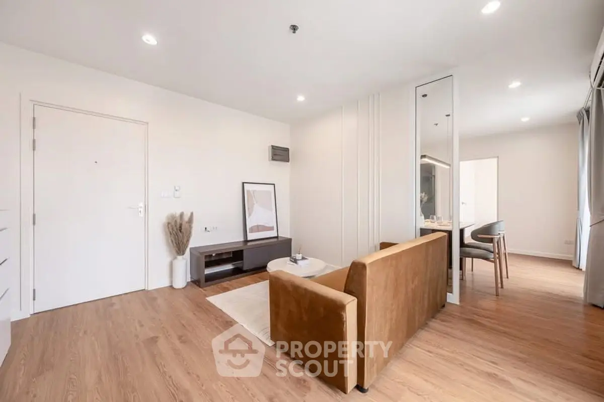 Modern living room with stylish decor and open dining area