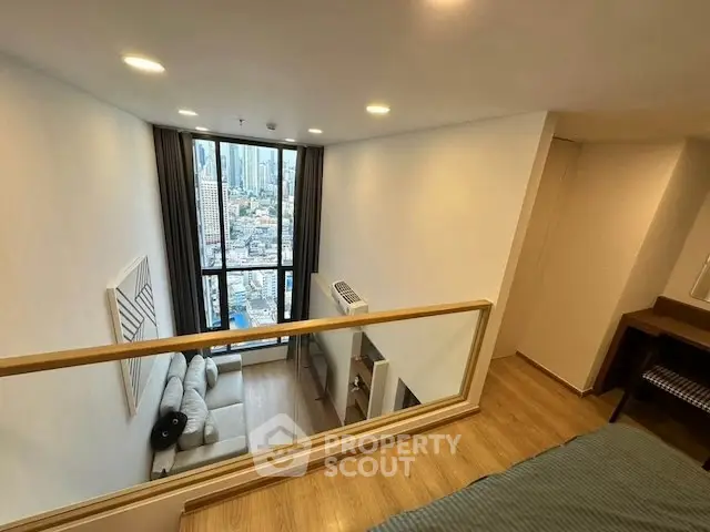 Modern loft apartment with stunning city view and stylish interior design.