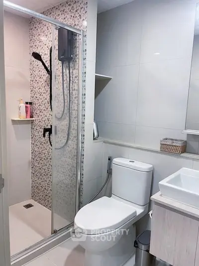 Modern bathroom with glass shower and sleek fixtures