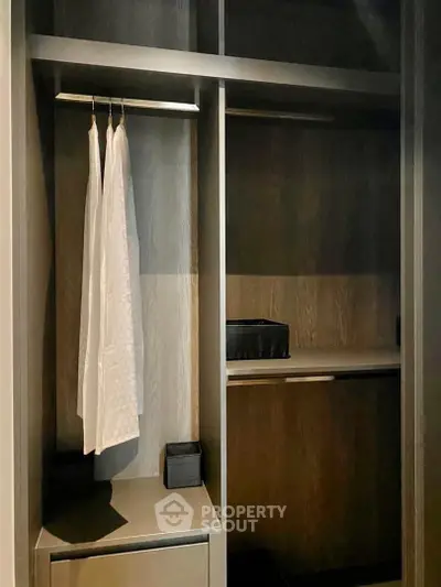 Spacious walk-in closet with modern design and ample storage space.