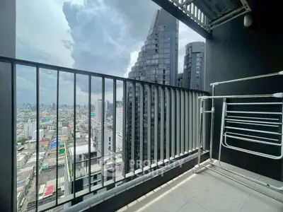 Stunning cityscape view from a modern high-rise balcony, perfect for urban living.