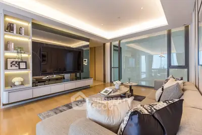 Luxurious modern living room with sleek design and large TV, perfect for relaxation and entertainment.