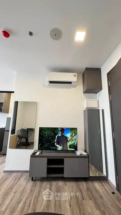 Modern living room with sleek air conditioning and stylish TV setup