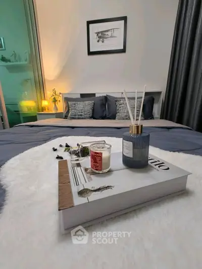 Cozy bedroom with elegant decor and soft lighting, perfect for relaxation and comfort.