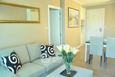 Elegant living room with modern decor and dining area in a stylish apartment