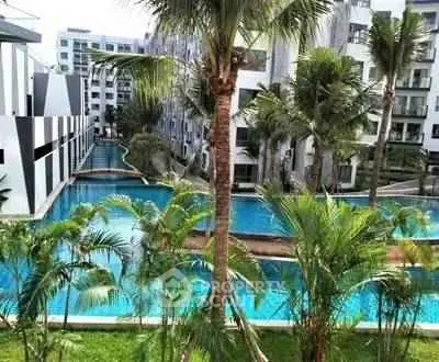 Luxurious residential complex with stunning pool and lush greenery