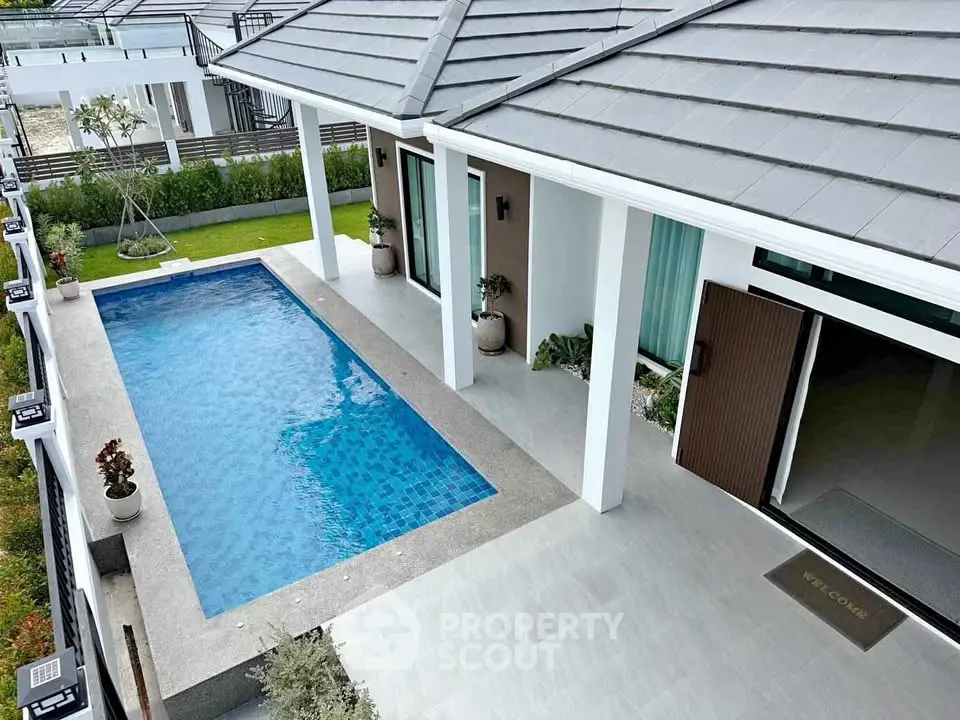 Luxurious modern home with private pool and elegant exterior design, perfect for relaxation and entertainment.