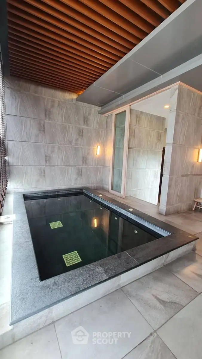Luxurious indoor pool with modern design and elegant lighting