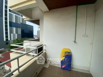 Spacious balcony with city view, perfect for relaxation and enjoying the outdoors.