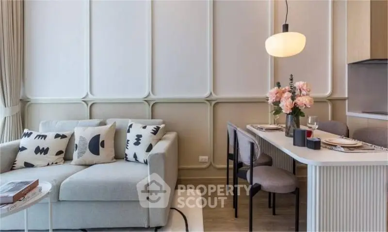 Stylish modern living room with elegant dining area and cozy sofa