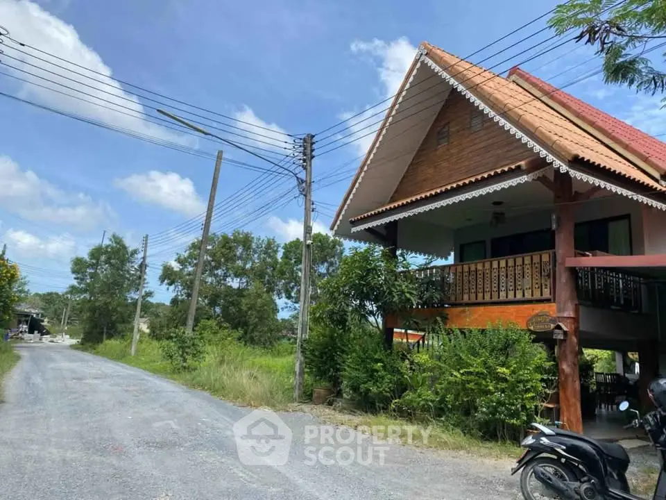 Charming rustic house with traditional architecture and lush greenery, perfect for serene countryside living.