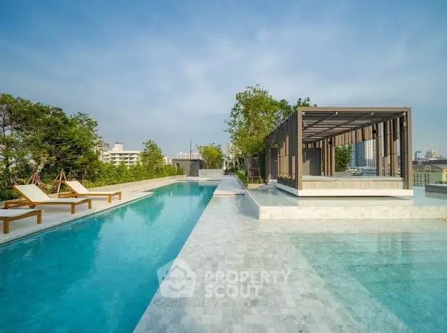 Luxurious rooftop pool with modern cabana and city skyline view