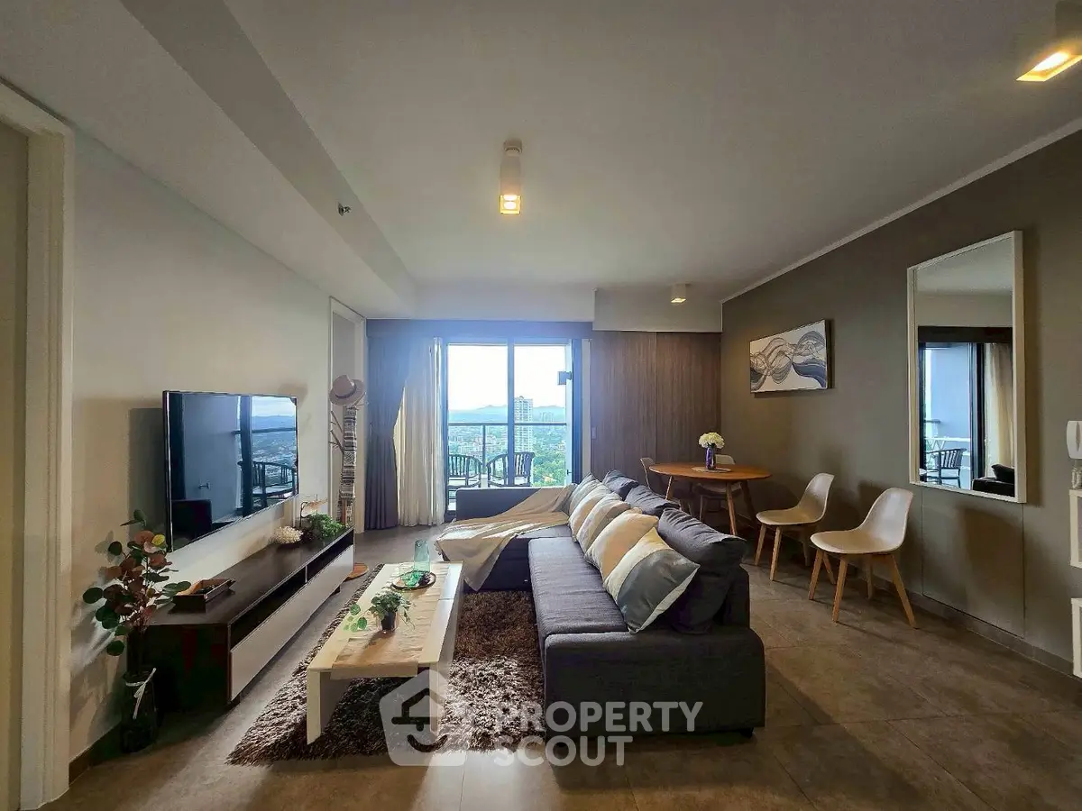 Spacious modern living room with large windows and stylish decor