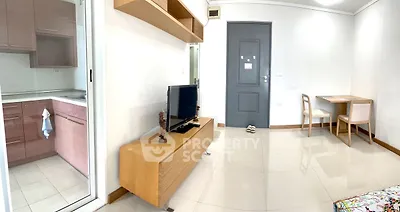 Modern apartment interior with open kitchen and cozy living area