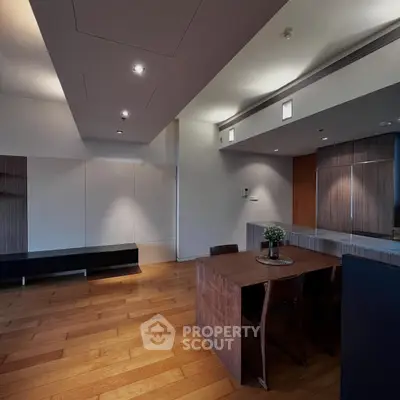 Spacious modern living room with wooden flooring and stylish dining area.
