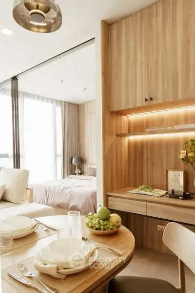 Modern open-plan living and dining area with wooden accents and natural light