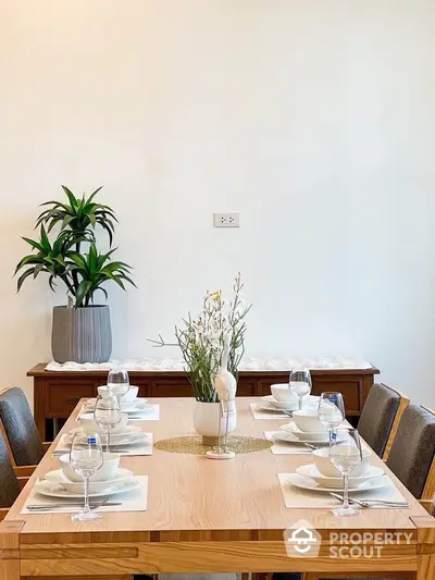 Elegant dining room with modern wooden table and stylish decor