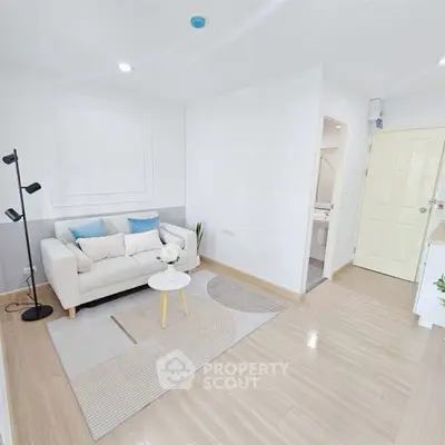 Bright and modern living room with cozy sofa and stylish decor