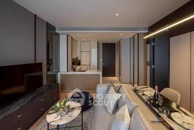 Modern living room with open kitchen, sleek furniture, and stylish decor in a contemporary apartment.