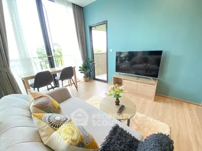 Bright and modern living room with balcony access and stylish decor