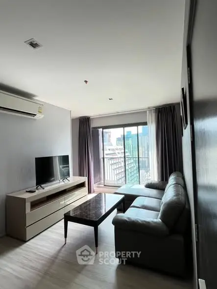 Modern living room with city view and sleek furniture