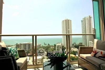 Luxurious balcony with stunning ocean view in high-rise apartment