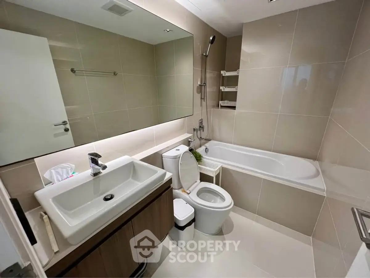 Modern bathroom with bathtub and sleek fixtures