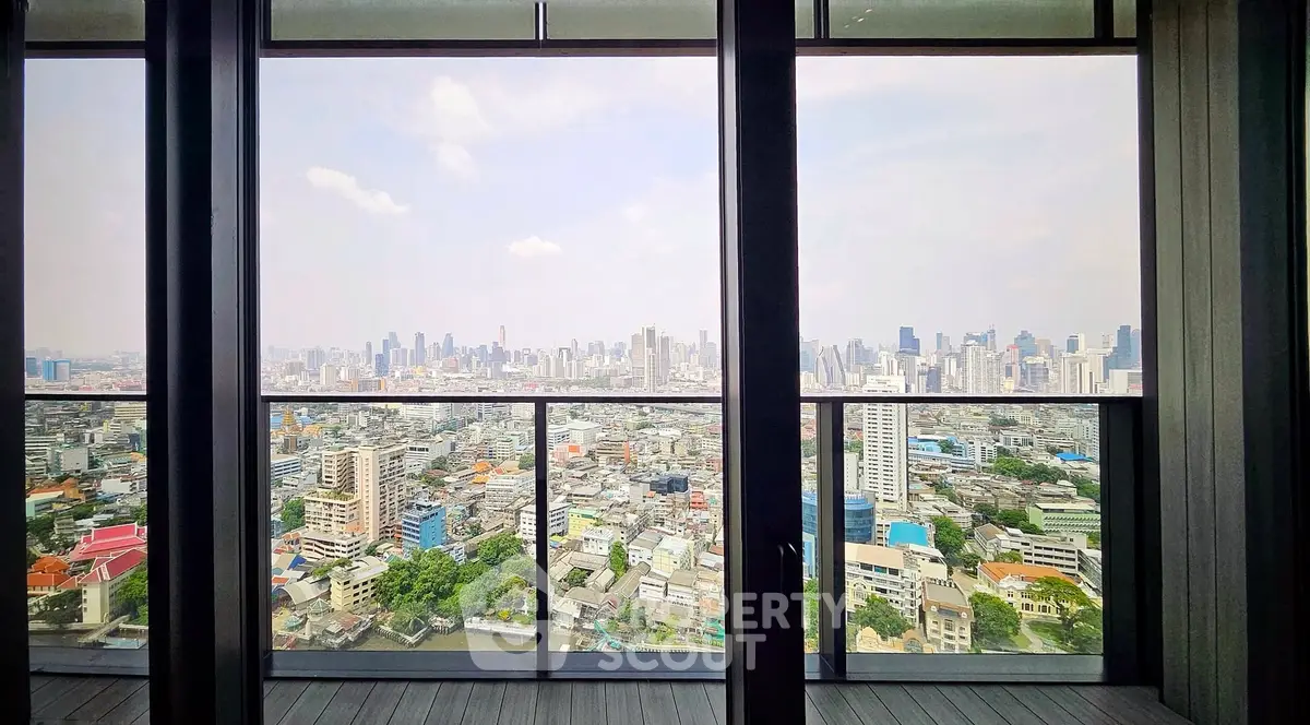 Stunning cityscape view from a high-rise balcony with expansive skyline and urban landscape.