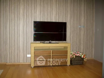 Modern living room with stylish TV stand and striped wallpaper