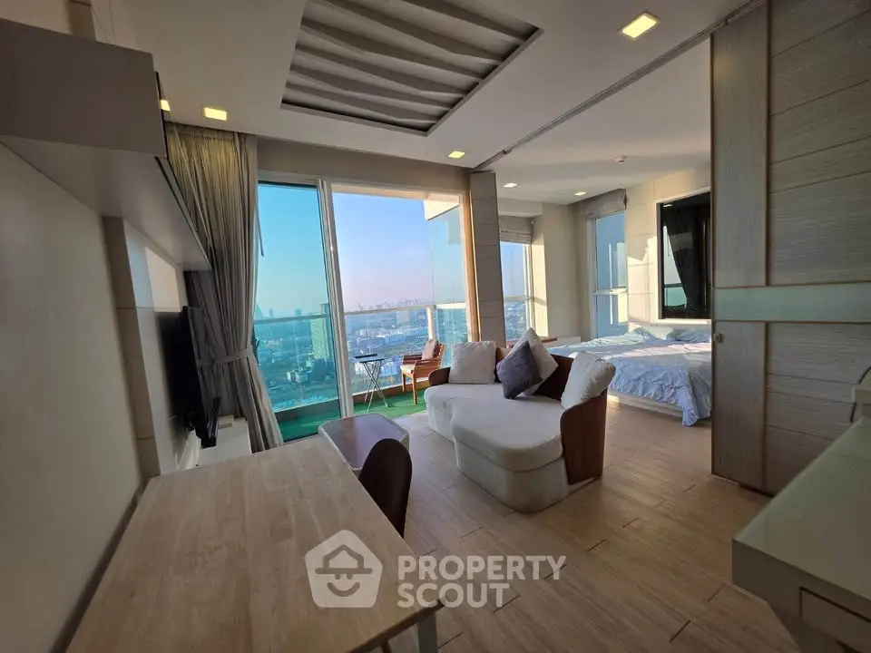 Luxurious open-plan living room with stunning sea view and modern furnishings