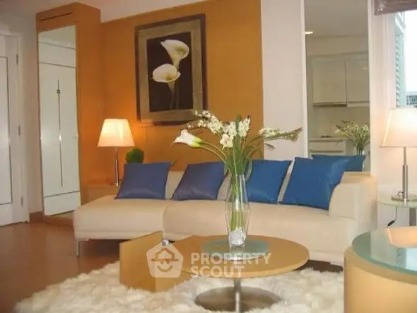 Stylish living room with modern decor and cozy seating area.