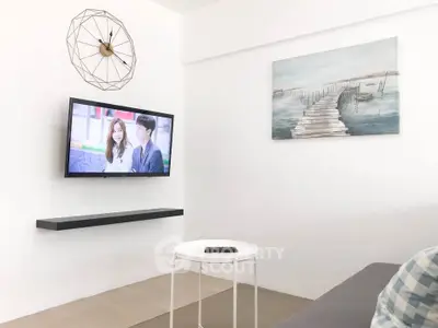 Modern living room with wall-mounted TV and stylish decor