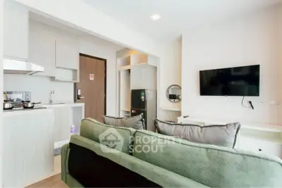 Modern living room with open kitchen and stylish decor