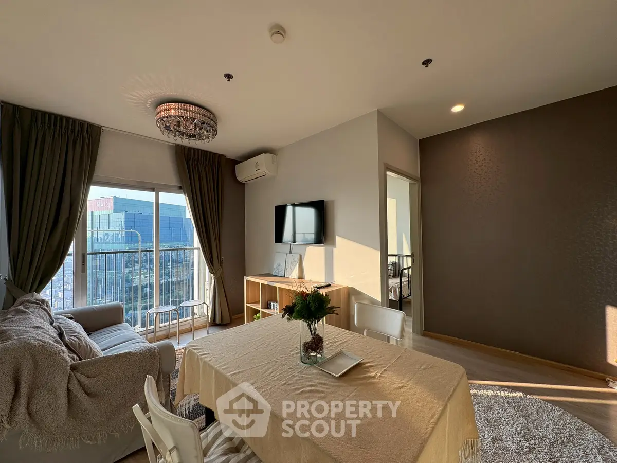 Spacious living room with elegant decor and balcony view in modern apartment