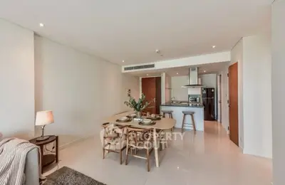 Modern open-plan living and dining area with stylish kitchen and elegant decor.
