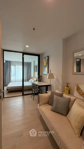 Modern apartment interior with cozy living room and stylish bedroom view.