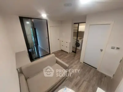 Modern living room with sleek design and open kitchen layout