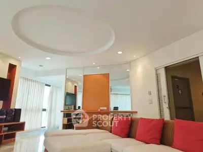 Spacious modern living room with stylish decor and natural light