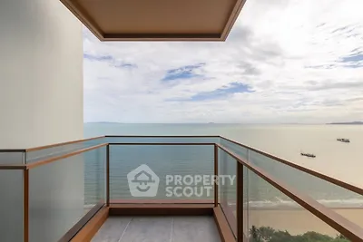 Stunning ocean view from modern balcony in luxury beachfront property.