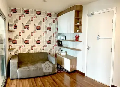 Charming living room with stylish wallpaper and modern shelving, perfect for cozy relaxation.
