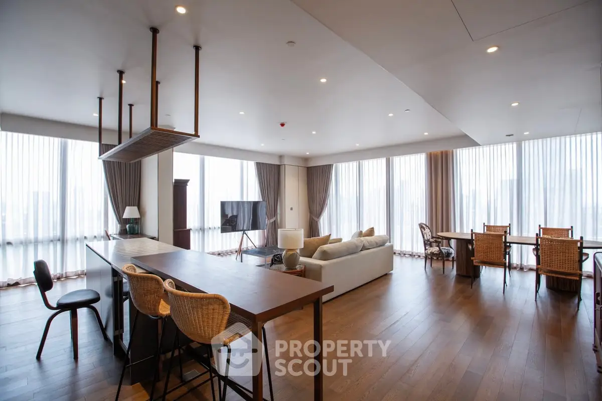 Spacious modern living room with open kitchen and elegant decor