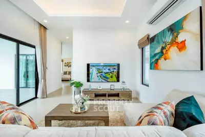 Spacious modern living room with stylish decor and large windows
