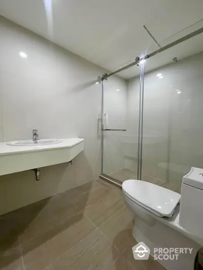 Modern bathroom with sleek shower enclosure and minimalist design